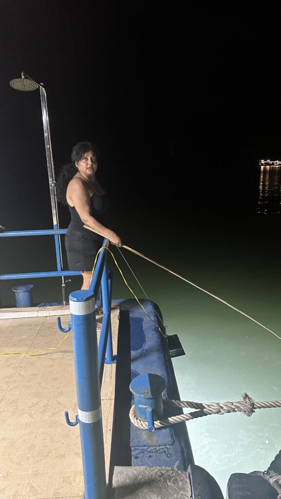 Image of the author, Fauzia Rizvi fishing on the cruise 