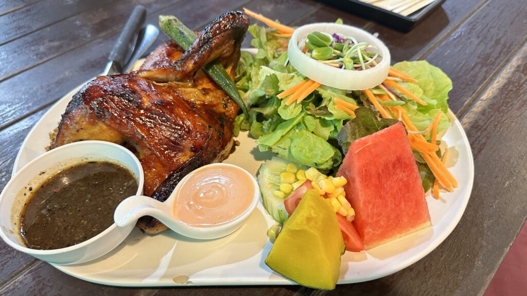 This image is of Chicken BQQ salad prepared by the Baan Moo Rom Kwan in Phuket. | www.followfauzia.com